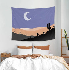 Desert landscape tapestry with a crescent moon and cactus silhouettes.
