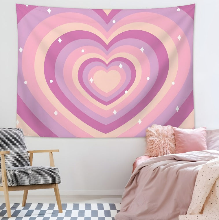 Pink and purple heart-pattern tapestry hanging above a bed.