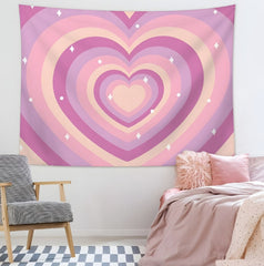 Pink and purple heart-pattern tapestry hanging above a bed.